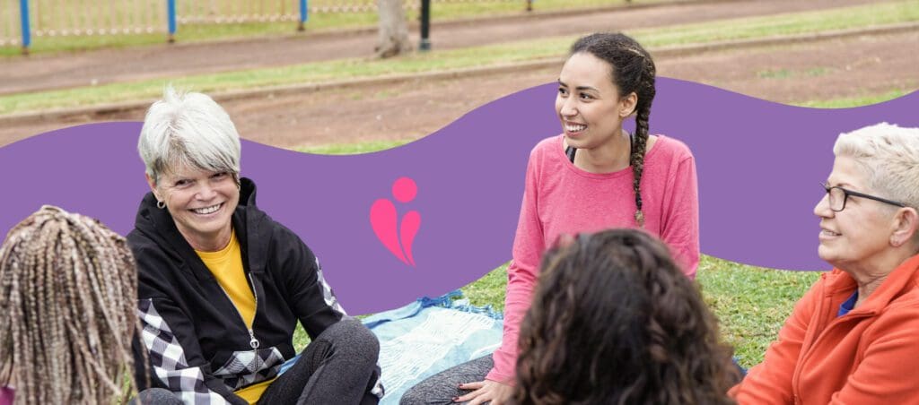 NDIS support group sitting outside talking