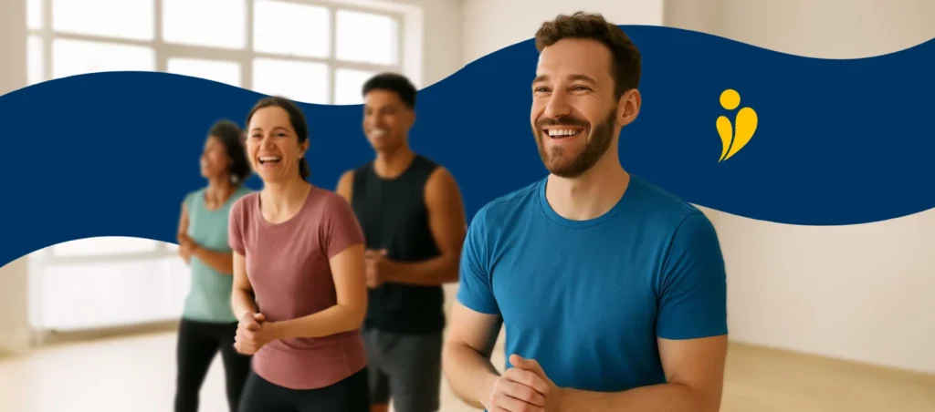 2 men and 2 women smiling at an exercise class